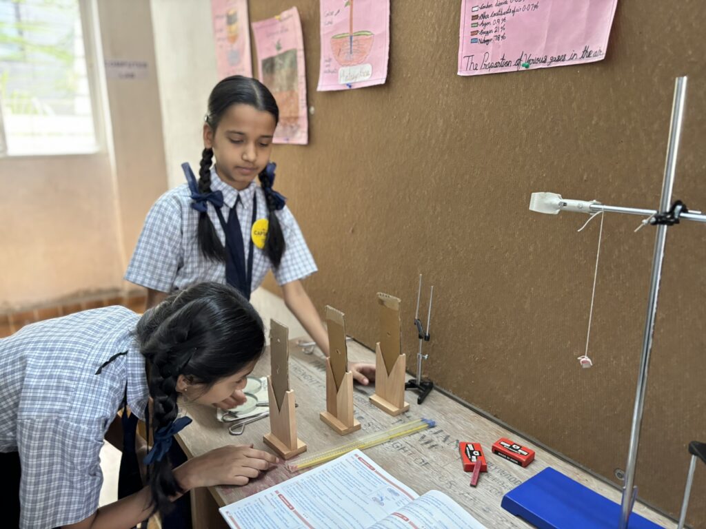 WonderKids Academy students doing a science activity